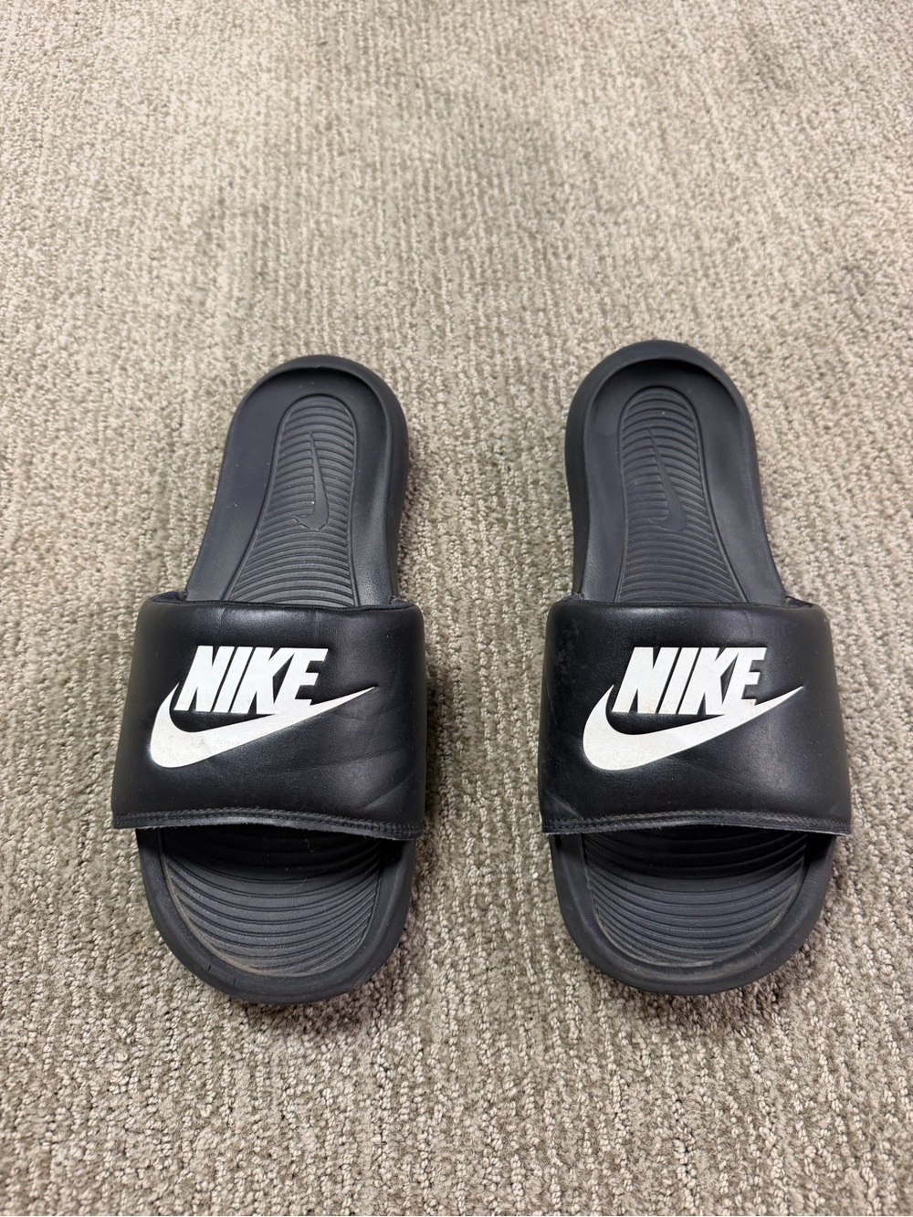 Nike Black Slides with White Swoosh Logo